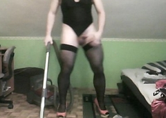 hoovering adjacent to X-rated thong leotard