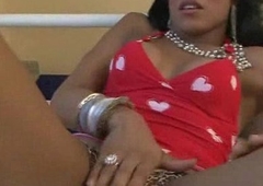 She has big tits and a big latina dick that she tuggs on